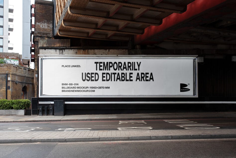 Wide horizontal billboard mockup under industrial bridge with brick backdrop