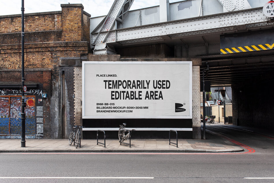 Large horizontal billboard mockup with white background under metal bridge structure