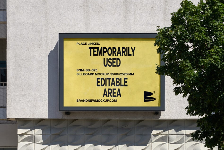 Bright yellow billboard mockup mounted on concrete wall with ivy vines