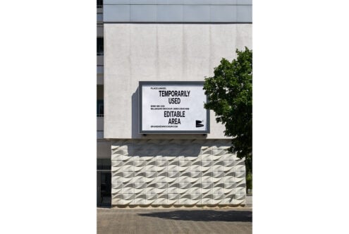 Billboard mockup on modern building facade perfect for graphic design projects showcasing editable templates and promotional content for designers.