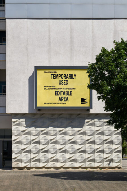 Yellow billboard on contemporary building with geometric concrete base