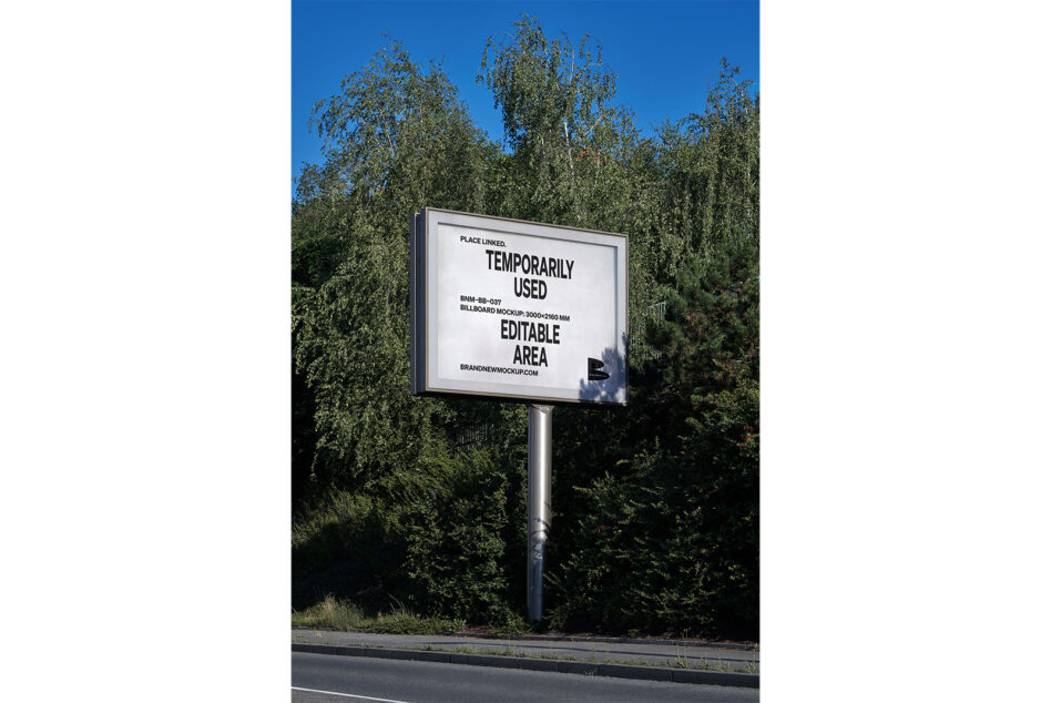 Roadside billboard mockup surrounded by tall green trees under clear blue sky