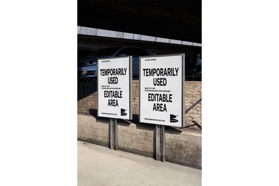 Two horizontal poster mockups mounted on concrete barrier in parking garage