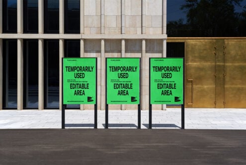 Street poster mockup in urban setting featuring three green editable posters for graphic design projects showcasing customizable templates for designers.
