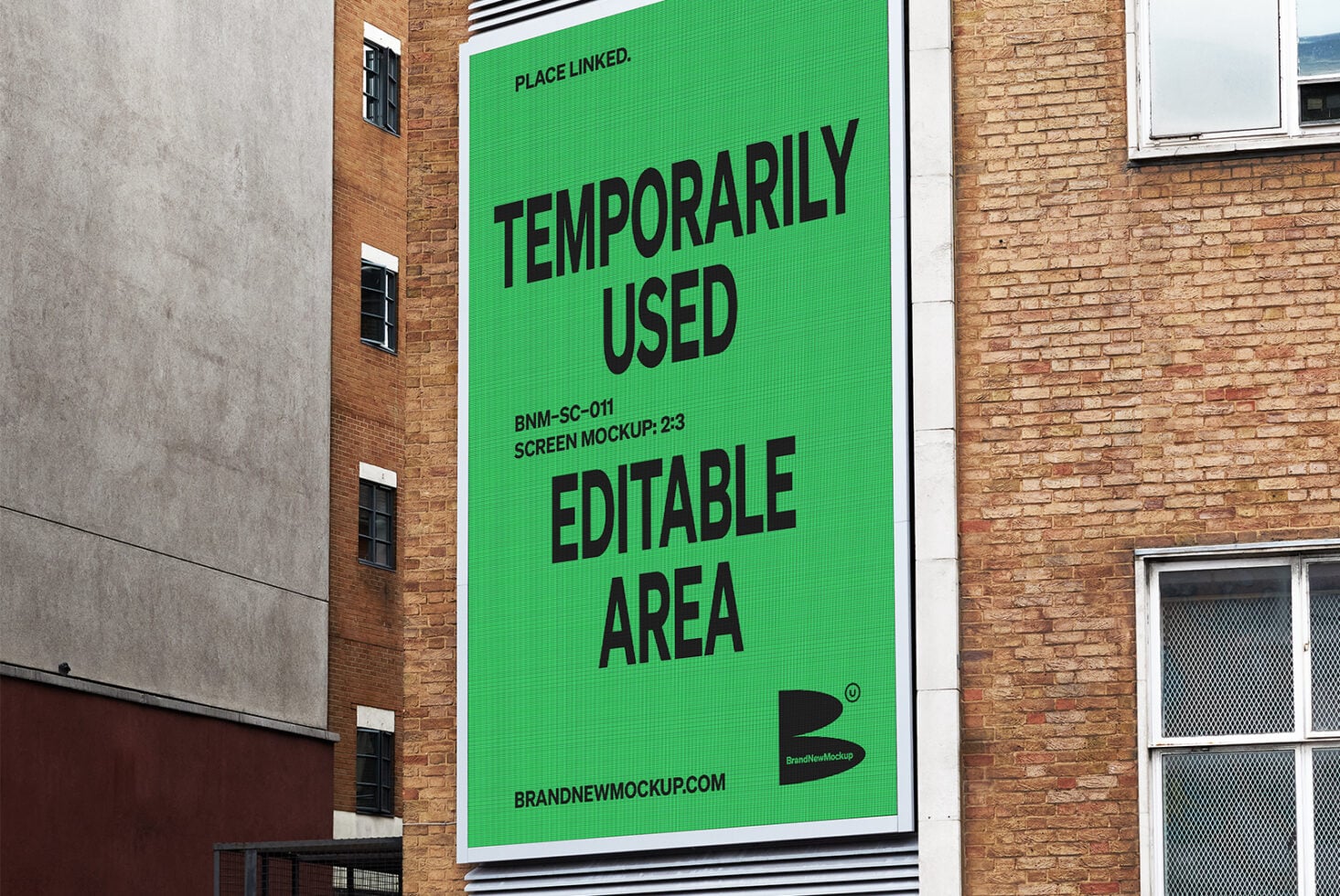Large green outdoor screen display on brick building, text space customizable