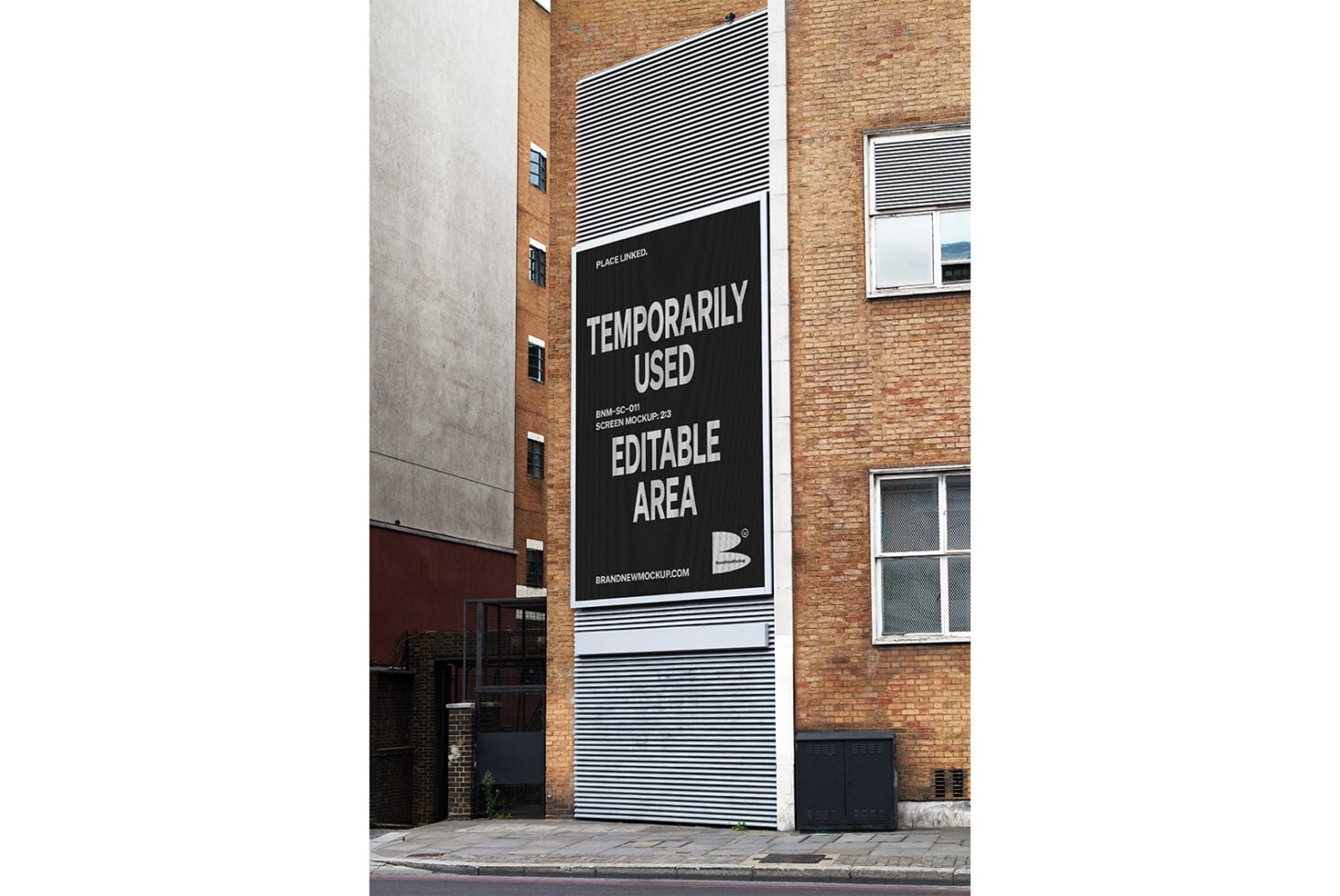 Black building screen mockup on brick wall with striped design, ready to edit