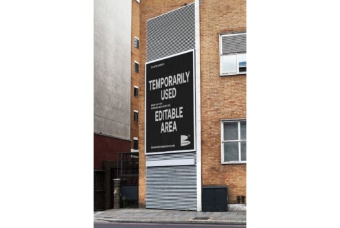 Urban building billboard mockup with editable area for design display. Ideal for showcasing ads, posters, or branding in realistic street settings.
