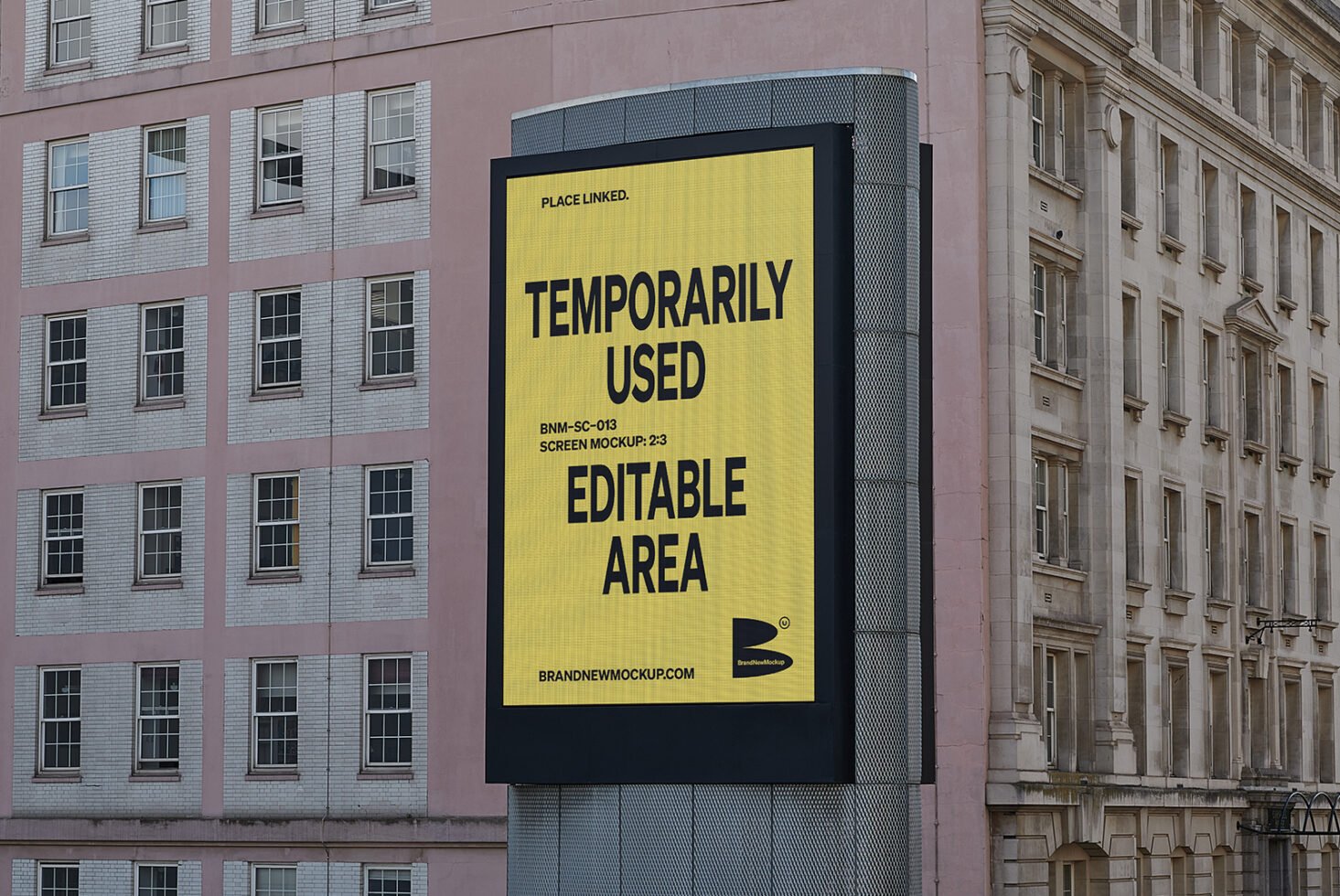 Building facade with a large billboard showcasing a yellow screen mockup template for designers. Editable area for custom designs. Urban backdrop.