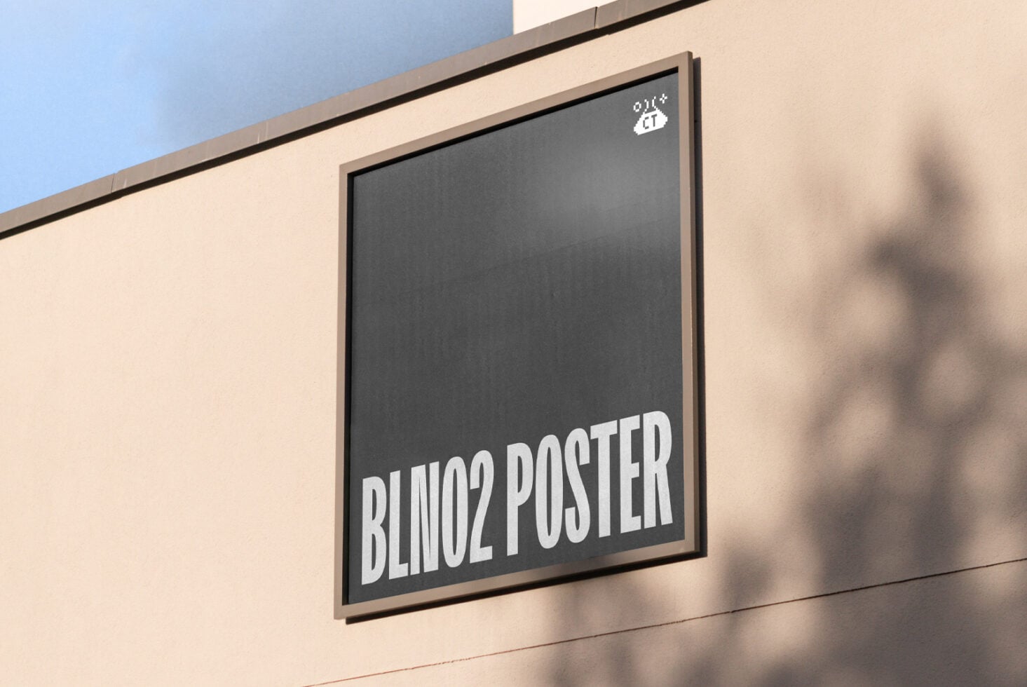 Framed charcoal-gray poster on cream wall with white text reading BLINO2 POSTER