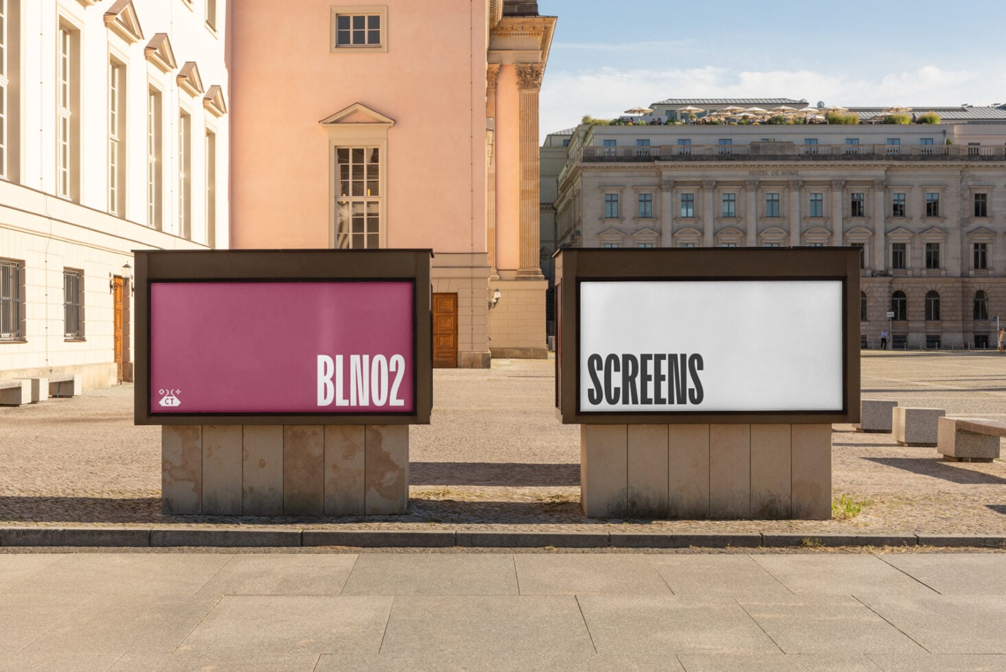 Two outdoor digital billboards in European plaza showing BLIN02 on magenta screen, SCREENS on white