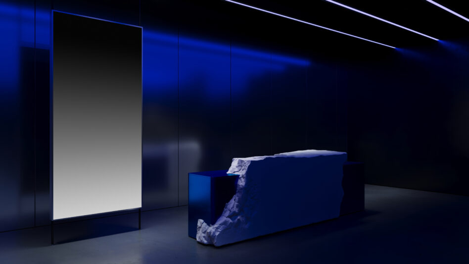 Modern interior design with a minimalist stone counter and large abstract art piece in a blue-lit room. Perfect for interior design mockups and graphics.