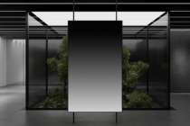 Minimalist gallery space with centered blank poster, floor plants, white walls