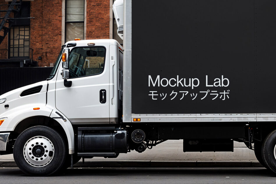 Side view of a delivery truck with Mockup Lab branding in English and Japanese. Ideal for designers seeking vehicle mockups and urban scene graphics.