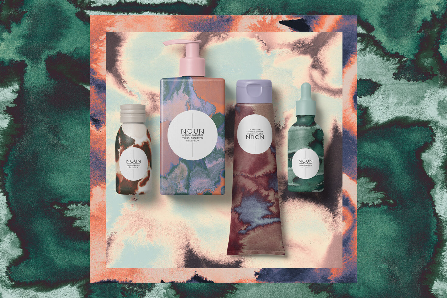 Cosmetic packaging mockup with abstract watercolor background. Includes bottles and tubes. Ideal for designers seeking unique and artistic templates.