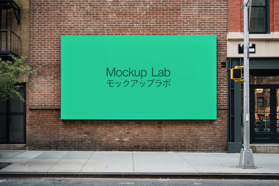 Solid teal rectangular billboard on exposed brick street facade mockup