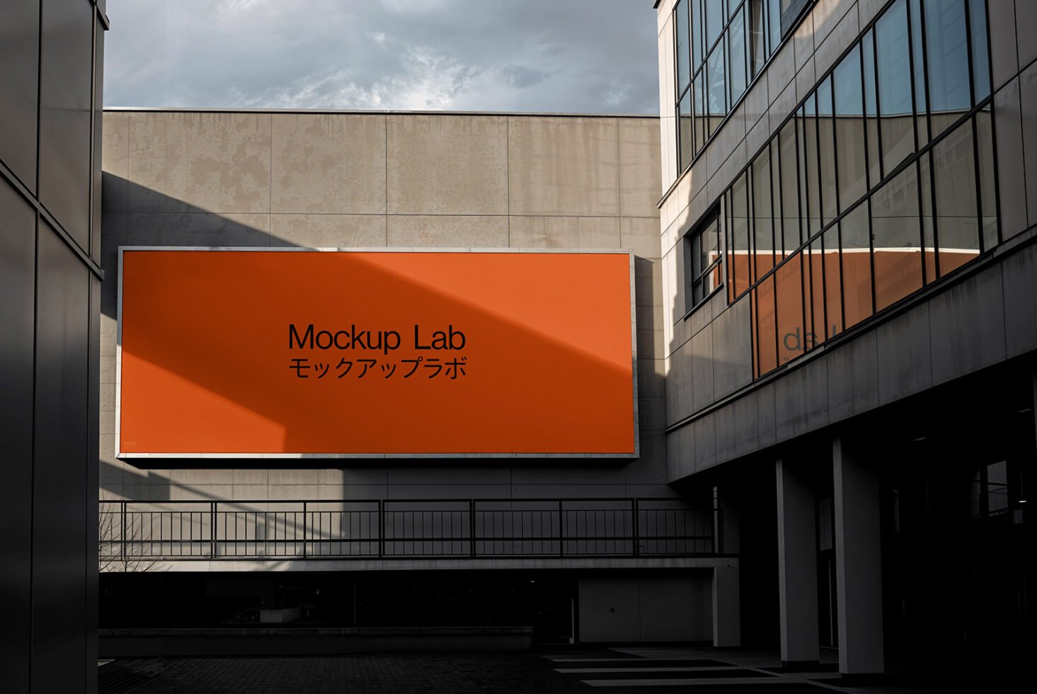 Outdoor billboard mockup in urban setting featuring bright orange background with modern design. Ideal for showcasing branding for designers and creatives.