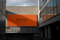 Horizontal orange billboard on contemporary architecture exterior wall