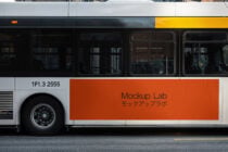 Orange horizontal bus panel mockup with text on urban transport vehicle