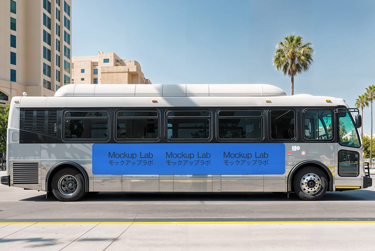 City bus wrap mockup for designers with modern building and palm trees, ideal for showcasing advertising designs. Perfect for urban branding concepts.