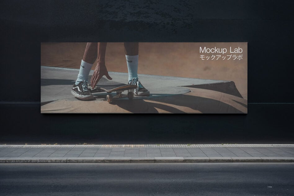 Wall-mounted skateboard banner mockup featuring legs in sneakers on a dark street background. Ideal for designers seeking realistic outdoor advertising templates.