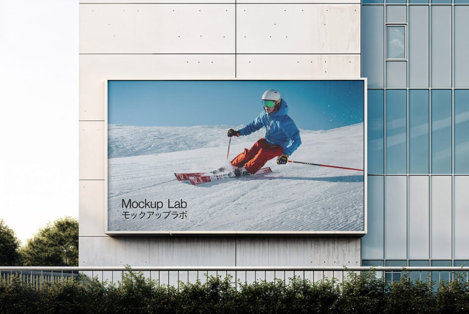 Billboard mockup with skier on snowy slope against modern building backdrop ideal for graphics and template designers seeking dynamic outdoor scenes