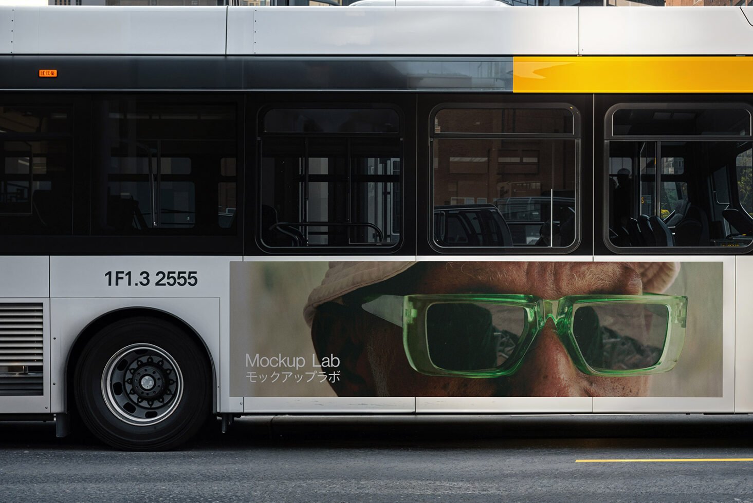 Bus side view with an ad mockup template featuring a person in green glasses. Ideal for graphic designers in need of realistic advertising mockups.