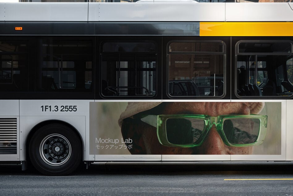 Bus side view with an ad mockup template featuring a person in green glasses. Ideal for graphic designers in need of realistic advertising mockups.