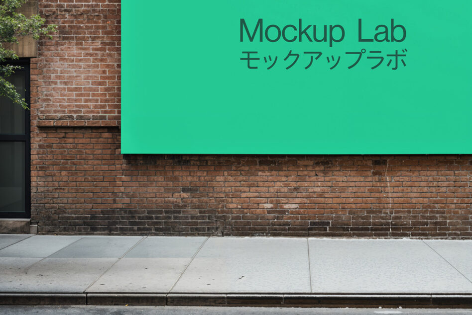 Bright teal horizontal sign on old brick storefront with ivy detail