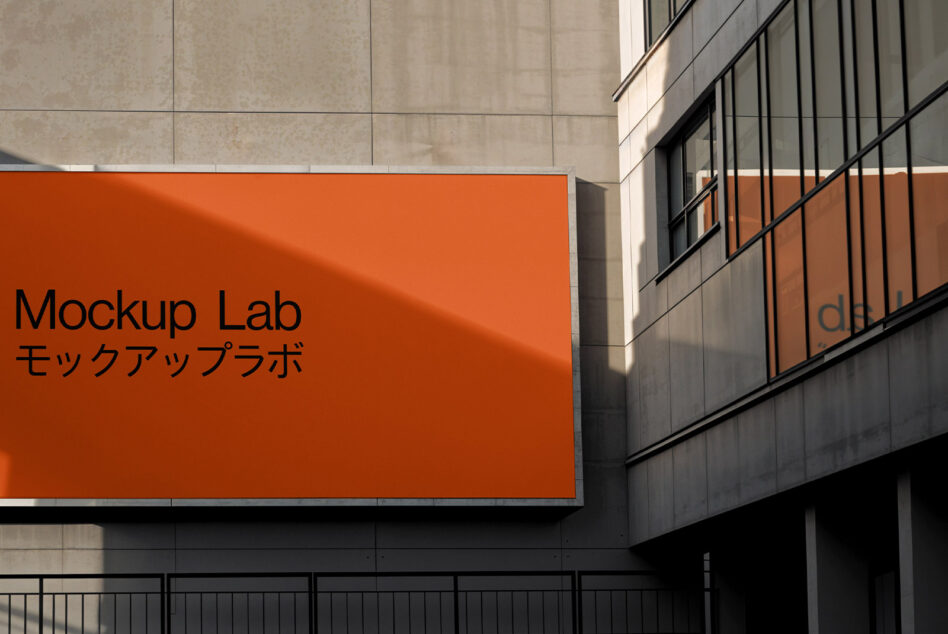 Outdoor billboard mockup with modern orange design on urban building facade ideal for architecture branding templates and graphic design projects.