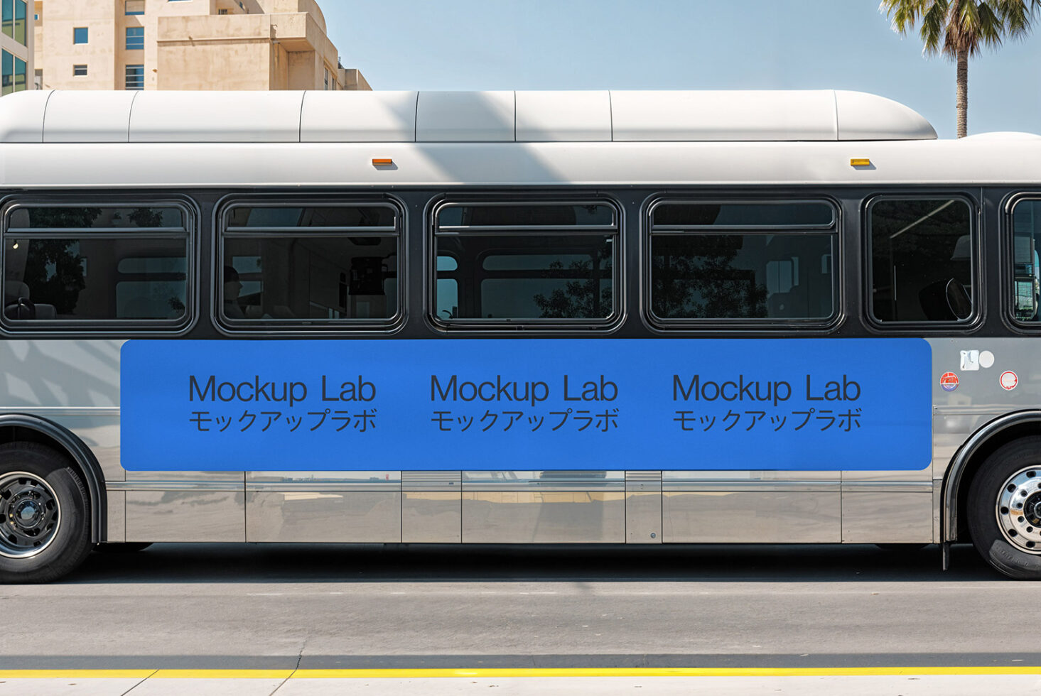 Bus side banner mockup featuring the text Mockup Lab with Japanese characters. Ideal for designers needing realistic advertising presentations. Templates.