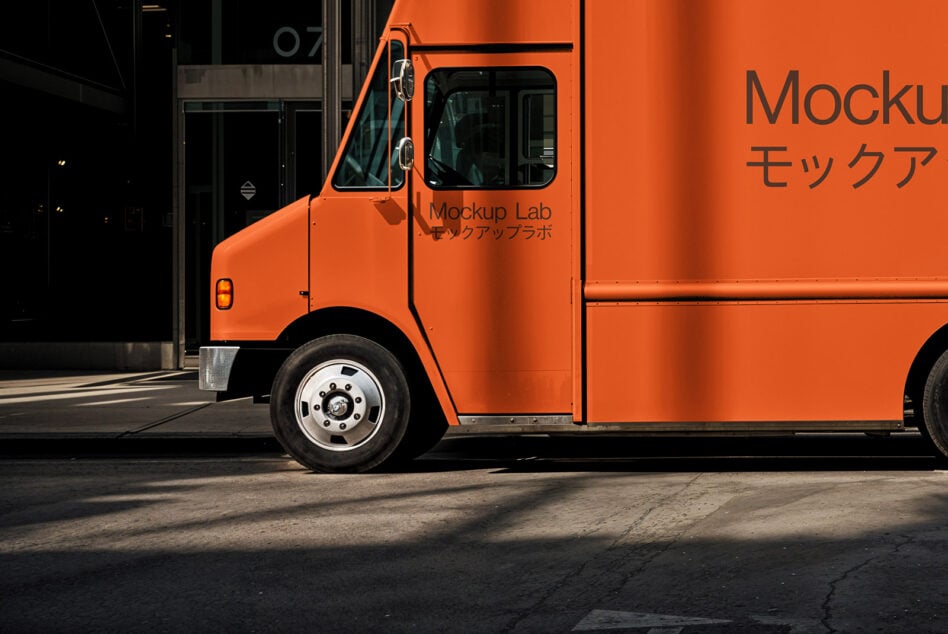 Orange truck side view labeled Mockup Lab for digital design showcasing. Ideal for graphic designers seeking realistic vehicle mockup templates.