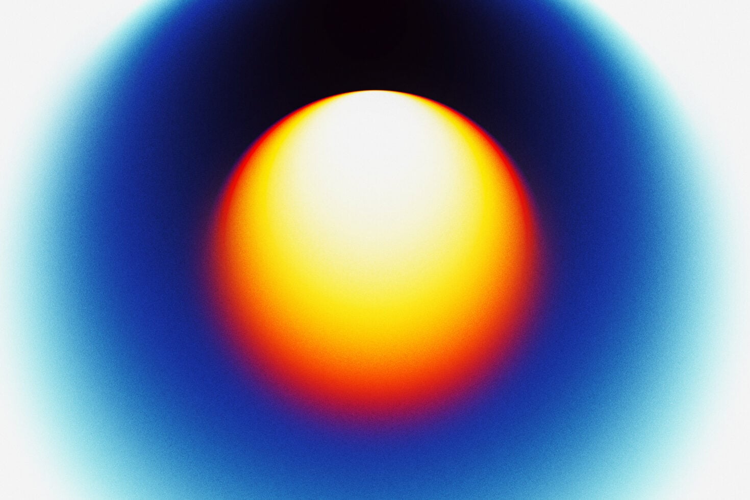 Radial gradient with bright yellow white core surrounded by warm orange into deep cyan blue