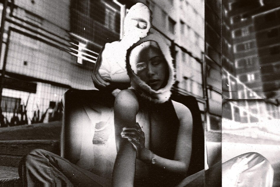 Grainy black white street photo of two people split into vertical panels with film grain