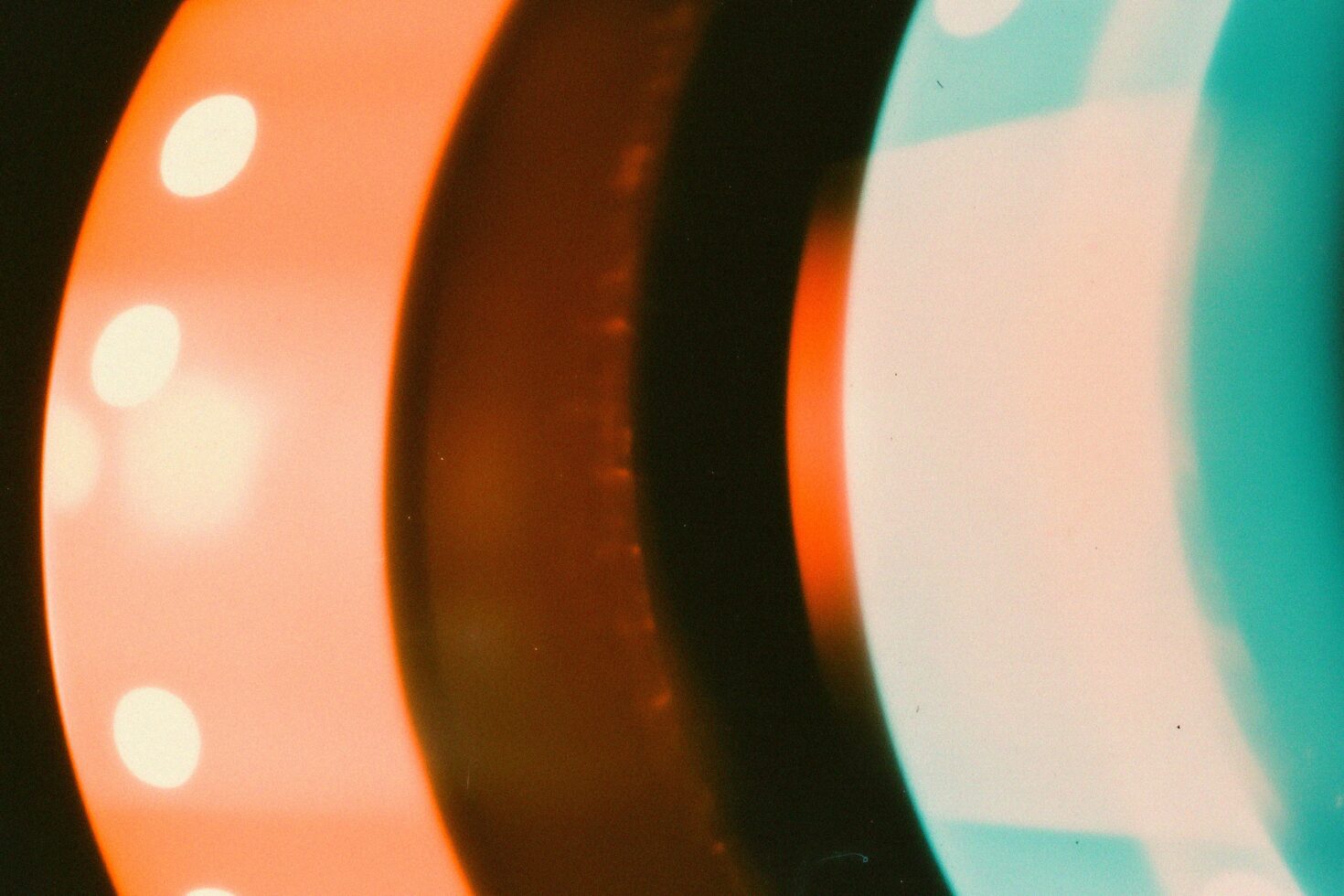 Abstract image of vibrant light reflections with orange and blue hues ideal for graphic design. Suitable for use as backgrounds or digital assets.