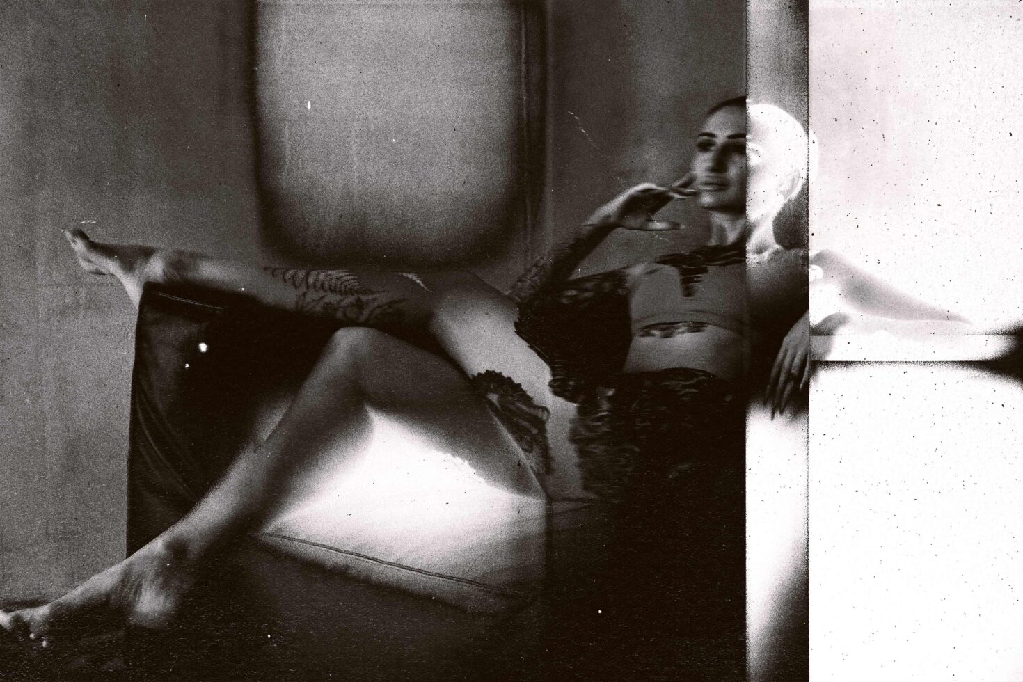 Grainy black-white film frame showing woman in interior, split frame mockup layout