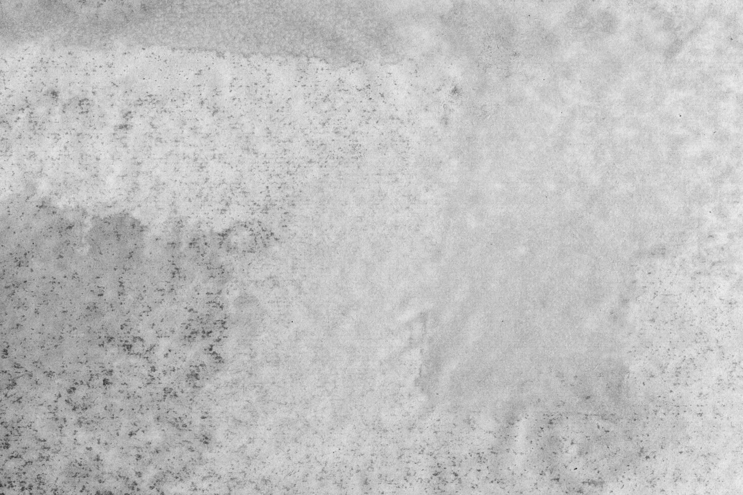 Gray textured background image suitable for graphics and templates. Ideal for designers seeking a subtle concrete texture for creative projects.