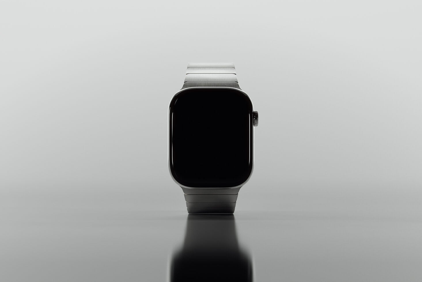 Silver smartwatch with black display screen shot straight on