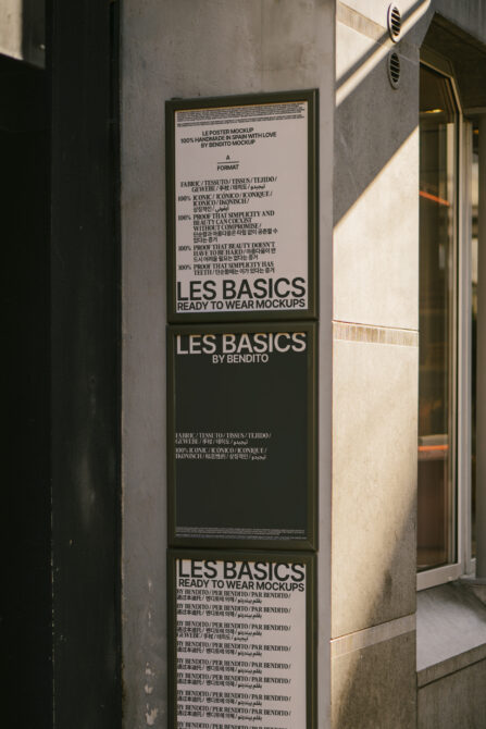Tall vertical poster mockup stack on concrete wall with light background panel