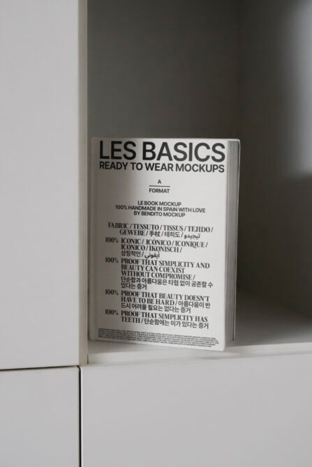 Les Basics Ready to Wear book mockup on white background, cream cover with multilingual text