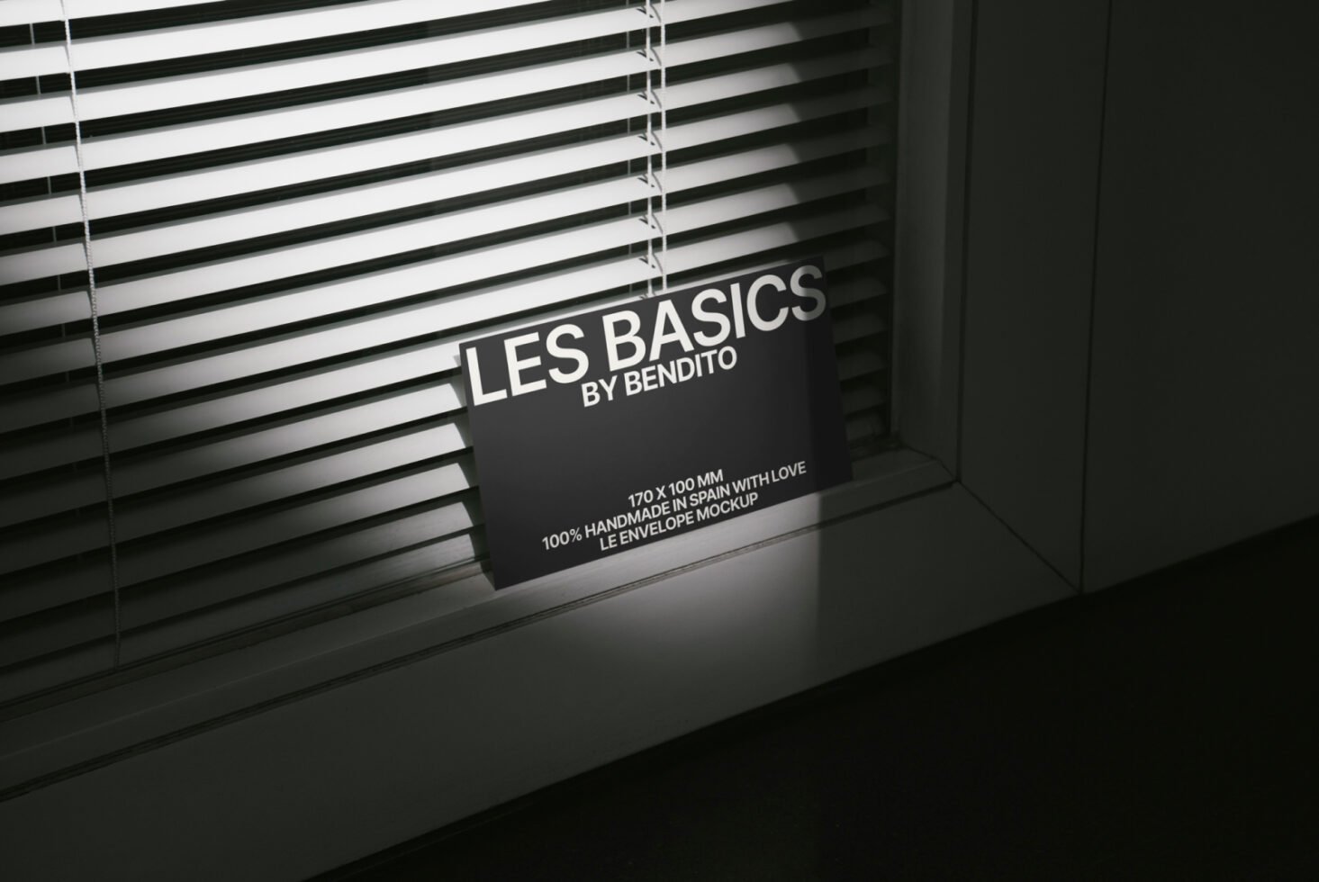 Envelope mockup design illuminated by window blinds highlighting text. Perfect for showcasing stationery products. Keywords: mockup, design, envelope.