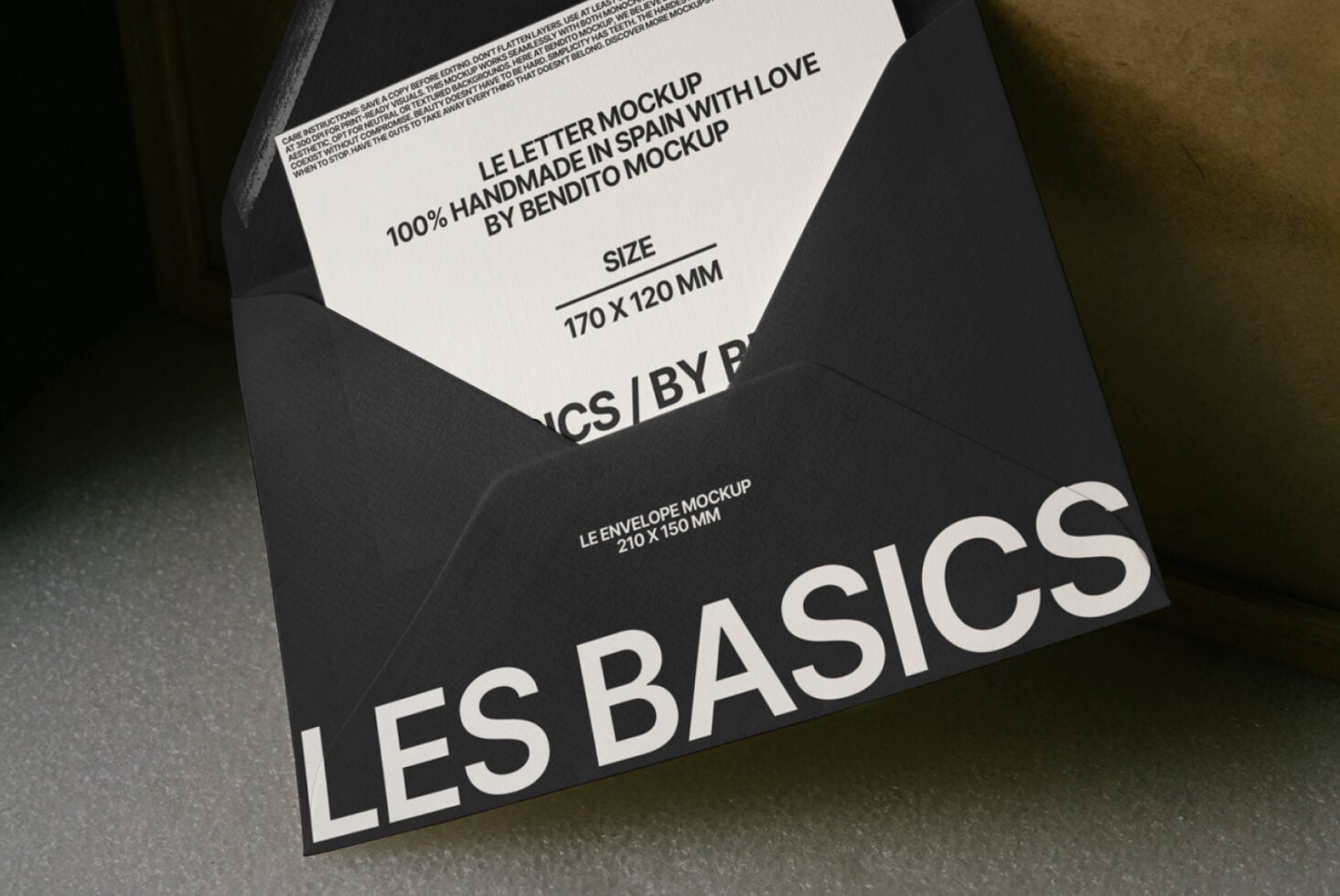 Black envelope mockup with white letter peeking out, Les Basics visible