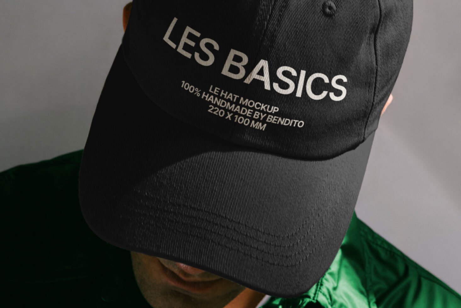 Black baseball cap mockup featuring embroidered text branding. Ideal for apparel design presentations. Download for graphic design templates and mockups.