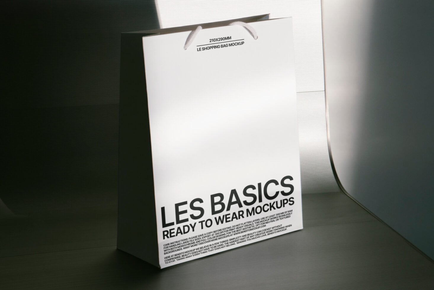 White paper bag mockup with handles leaning on dark background