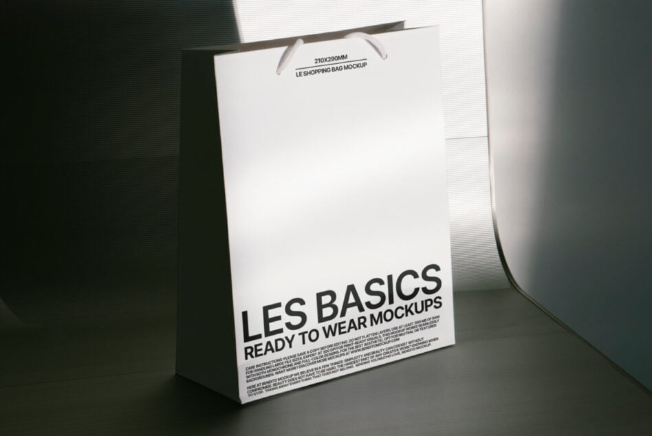 Mockup of a minimalist shopping bag with LES BASICS branding and ready to wear text suitable for promotional designs. Ideal for designers and creatives.
