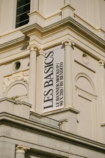 White banner displayed on neoclassical architecture with Corinthian capitals