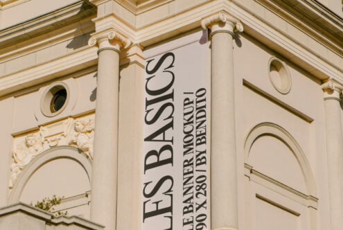 Elegant urban wall banner mockup showcasing serif font design against classic architecture ideal for graphic designers and advertising templates.
