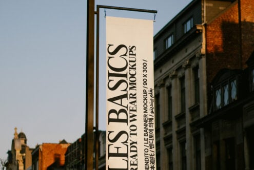 Urban vertical banner mockup in a city street setting for graphic designers. Ideal for showcasing branding and advertising projects in realistic environments.
