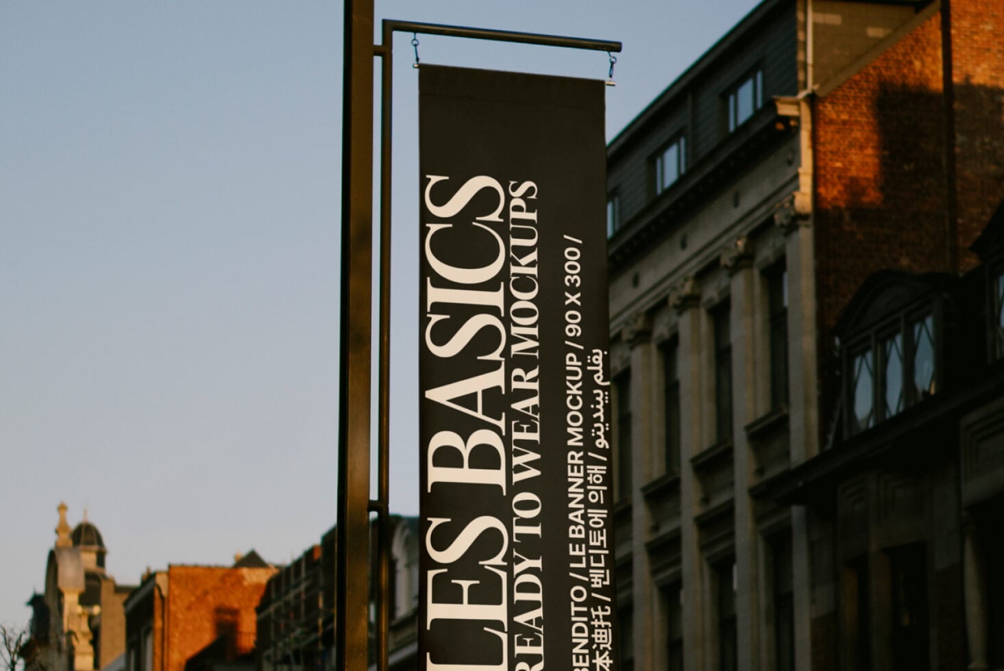 Dark street banner hanging from pole showing Les Basics Ready To Wear Mockups 90x300