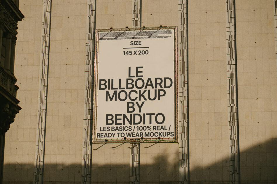 Cream banner on concrete wall showing Le Billboard Mockup 145x200 by Bendito