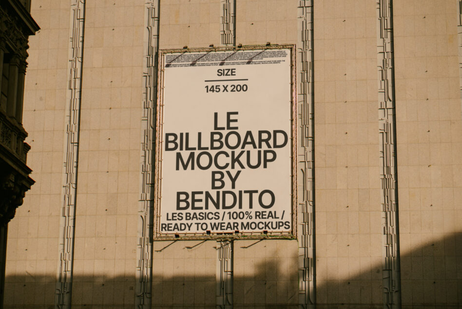 Cream banner on concrete wall showing Le Billboard Mockup 145x200 by Bendito